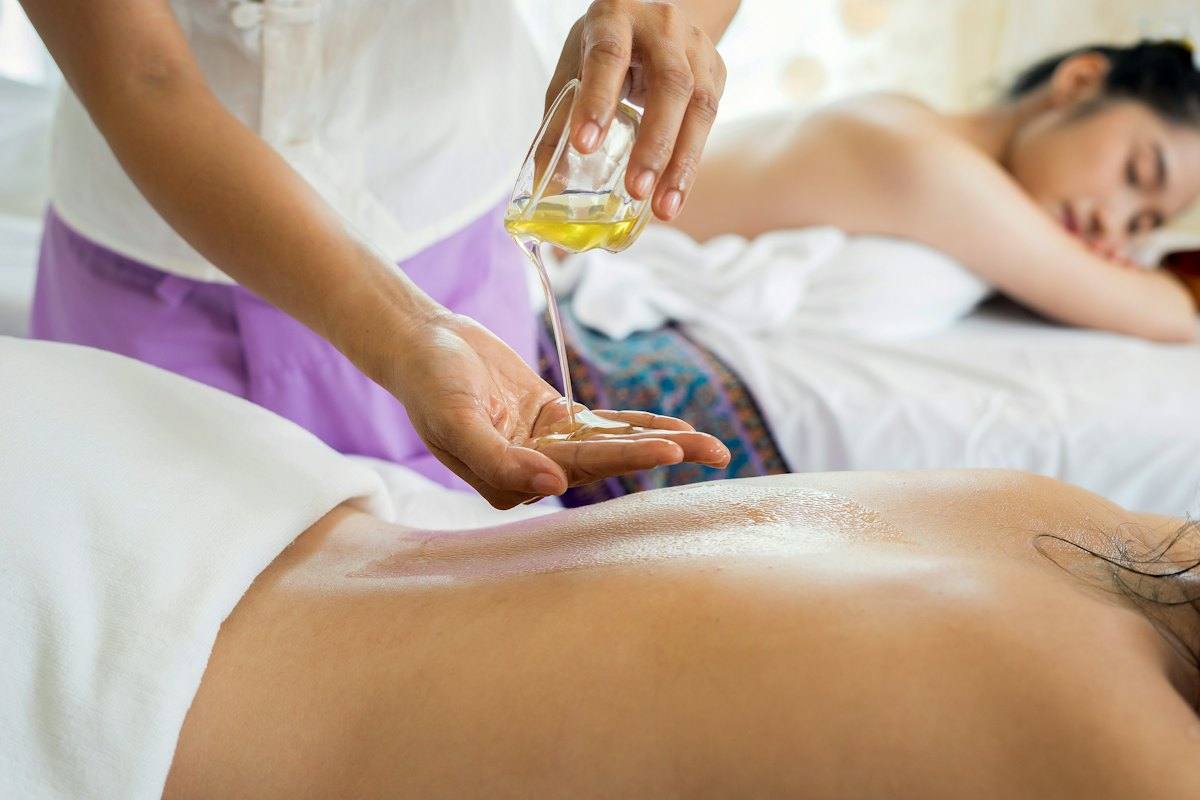 A massage being given with warm oil